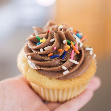 Nadia cakes - Frosted Animal Cracker. $3.50. You won’t want to miss these! A sprinkled cake batter cupcake dipped in a sugar glaze and topped with a sweet cake batter buttercream and a frosted animal cracker! Add to Cart.